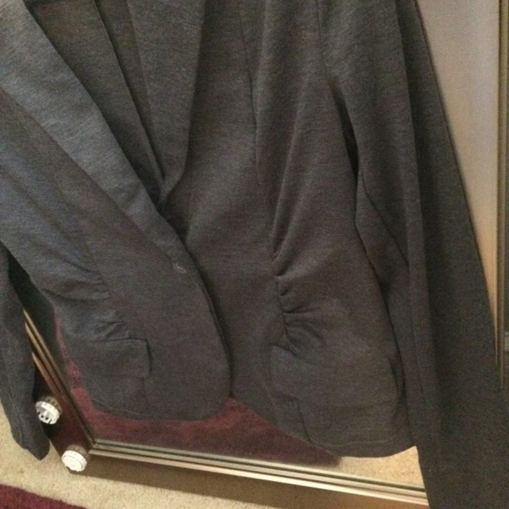 Grey jacket.